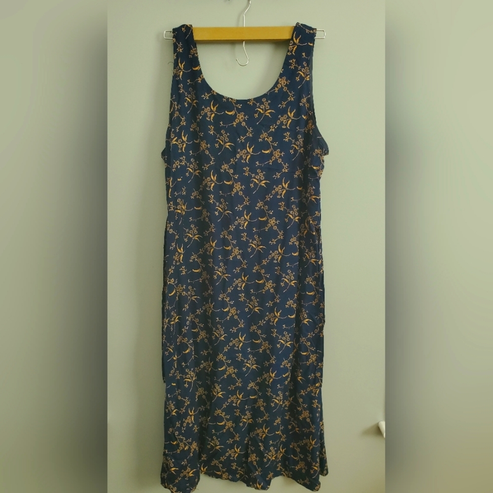 Navy blue dress with gold floral pattern. Size 16 with tie in the back